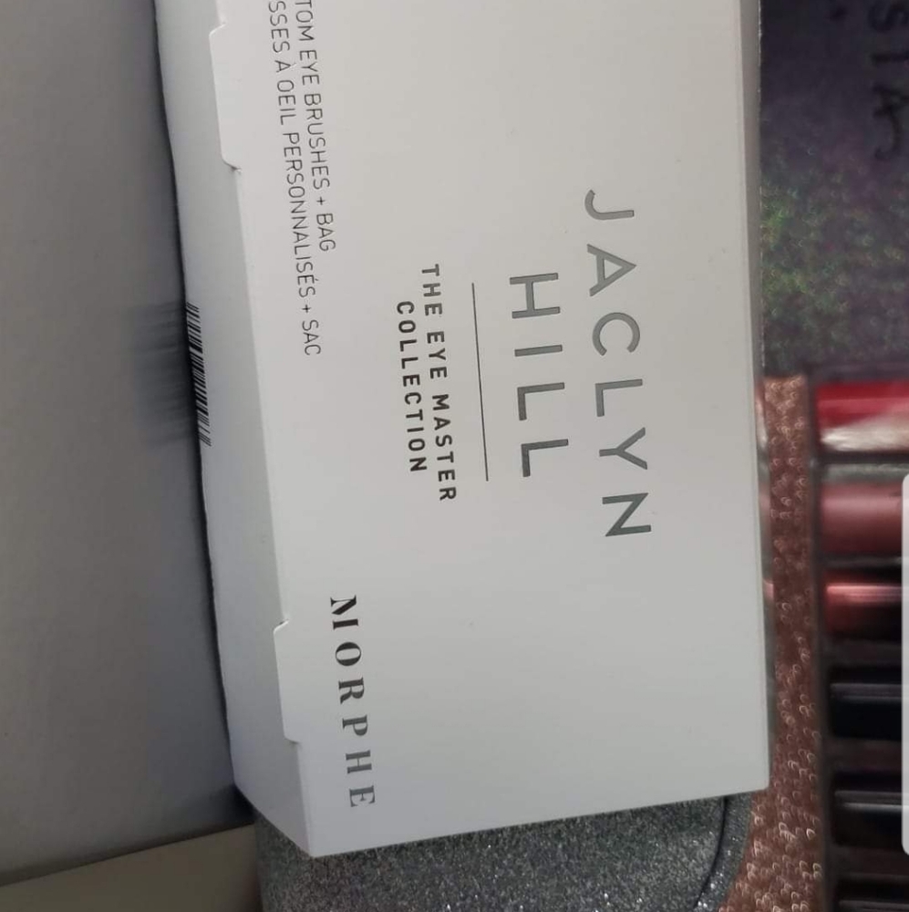Jaclyn Hill brushes with sparkle bag